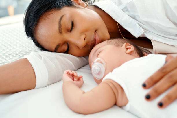 Peaceful mother and baby, well-rested after using a breast pump.