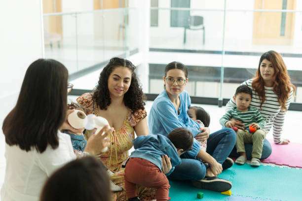 Mothers and babies in playgroup with breast pump supplies.